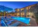 Picturesque backyard featuring a pool, spa, lounge chairs, and covered patio, creating an ideal outdoor oasis at 79 Rezzonico Dr, Henderson, NV 89011