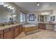 Spacious primary bathroom features a soaking tub, dual sinks, and granite countertops at 79 Rezzonico Dr, Henderson, NV 89011