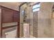 Modern bathroom features a glass shower, a tiled accent wall and ample storage at 79 Rezzonico Dr, Henderson, NV 89011