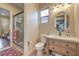 A well-appointed bathroom featuring a glass shower, vanity, and tile flooring for a luxurious feel at 79 Rezzonico Dr, Henderson, NV 89011