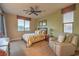 Comfortable bedroom features plush carpet, ceiling fan, and natural light at 79 Rezzonico Dr, Henderson, NV 89011
