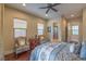 This bedroom boasts a ceiling fan, two windows, and stylish décor creating a relaxing atmosphere at 79 Rezzonico Dr, Henderson, NV 89011