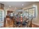 The dining area features a wooden table, hardwood floors, and a view of the patio at 79 Rezzonico Dr, Henderson, NV 89011