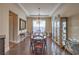 Formal dining room with hardwood floors, elegant chandelier, and tasteful decor at 79 Rezzonico Dr, Henderson, NV 89011