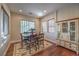 Formal dining room with hardwood floors, natural light, and a built-in china cabinet at 79 Rezzonico Dr, Henderson, NV 89011