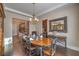 Elegant dining room with hardwood floors and an open layout, with a spiral staircase at 79 Rezzonico Dr, Henderson, NV 89011