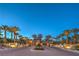 Grand entrance to a luxury community, showcasing lush landscaping and secure access at 79 Rezzonico Dr, Henderson, NV 89011