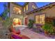 Cozy outdoor patio area with comfortable seating and lush landscaping, ideal for relaxation at 79 Rezzonico Dr, Henderson, NV 89011