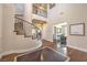 Elegant foyer with curved staircase, dark hardwood floors, and a soaring two-story ceiling at 79 Rezzonico Dr, Henderson, NV 89011