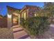 Inviting front entryway with a stone facade, steps to the front door, and mature landscaping at 79 Rezzonico Dr, Henderson, NV 89011