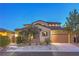 Charming two-story home featuring stone accents, a tiled roof and well-maintained landscaping at 79 Rezzonico Dr, Henderson, NV 89011