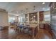 Open kitchen with granite island, stainless appliances, dark wood cabinets, and breakfast nook at 79 Rezzonico Dr, Henderson, NV 89011
