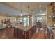 Spacious kitchen with a large island and stainless steel appliances open to the living area at 79 Rezzonico Dr, Henderson, NV 89011