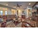 A large leather sofa, a coffee table, and a chess table create a warm and inviting living space at 79 Rezzonico Dr, Henderson, NV 89011