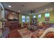Inviting living room featuring a large leather sofa and a mounted TV with a display niche at 79 Rezzonico Dr, Henderson, NV 89011