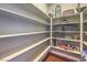 Walk-in pantry with custom shelving for organized storage at 79 Rezzonico Dr, Henderson, NV 89011