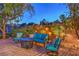 Inviting outdoor patio features comfortable seating and a charming fire pit, perfect for evening gatherings at 79 Rezzonico Dr, Henderson, NV 89011