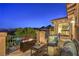 Relaxing outdoor patio boasts scenic views, cozy seating, and a modern fire pit table for year-round enjoyment at 79 Rezzonico Dr, Henderson, NV 89011