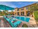 Backyard oasis featuring a pool, spa, and lounge chairs at 79 Rezzonico Dr, Henderson, NV 89011