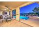 Outdoor patio with pool, spa, and built-in kitchen, ideal for entertaining guests in a luxurious setting at 79 Rezzonico Dr, Henderson, NV 89011