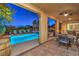 Charming outdoor patio with a pool, spa, and dining area, creating a perfect space for relaxation and entertainment at 79 Rezzonico Dr, Henderson, NV 89011