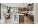 Modern kitchen featuring gray cabinetry, stainless steel appliances, and a spacious island with bar seating at 824 Weston Ridge St, Henderson, NV 89011