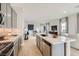Well-lit kitchen overlooks the open concept living room, ideal for entertaining and modern living at 824 Weston Ridge St, Henderson, NV 89011