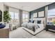 Tranquil primary bedroom suite with large windows, plush carpet, and calming decor at 824 Weston Ridge St, Henderson, NV 89011