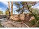 Backyard view featuring shade trees and perimeter block wall, great for privacy at 832 Clear Diamond Ave, Las Vegas, NV 89123