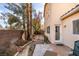 Backyard view featuring an easy-access back door and minimalist landscaping at 832 Clear Diamond Ave, Las Vegas, NV 89123