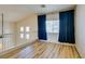 Upstairs space featuring wood floors, neutral walls, window with dark blue curtains at 832 Clear Diamond Ave, Las Vegas, NV 89123