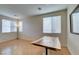 Sunlit dining area with wood table and windows offering ample natural light at 832 Clear Diamond Ave, Las Vegas, NV 89123