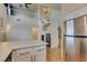 Open-concept kitchen featuring stainless steel appliances, breakfast bar, and modern fixtures at 832 Clear Diamond Ave, Las Vegas, NV 89123