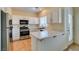 Modern kitchen with stainless steel appliances, ample counter space, and white cabinetry at 832 Clear Diamond Ave, Las Vegas, NV 89123