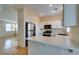 Updated kitchen with white cabinets, stainless steel appliances, and ample countertop space at 832 Clear Diamond Ave, Las Vegas, NV 89123
