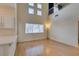 Living room with high ceilings and a large window allowing for natural light at 832 Clear Diamond Ave, Las Vegas, NV 89123