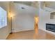 Living room with high ceilings, modern fireplace, and natural light at 832 Clear Diamond Ave, Las Vegas, NV 89123