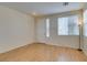 Bright living room with wood floors, front door and abundant natural light from multiple windows at 832 Clear Diamond Ave, Las Vegas, NV 89123