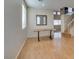 Bright living room with wood floors, table, staircase, and abundant natural light at 832 Clear Diamond Ave, Las Vegas, NV 89123