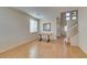 Bright living room with wood floors, staircase, high ceilings, and natural light at 832 Clear Diamond Ave, Las Vegas, NV 89123