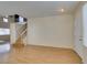 Bright living room with wood floors, staircase and easy access to the front door at 832 Clear Diamond Ave, Las Vegas, NV 89123