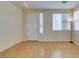 Bright living room with wood floors, front door and abundant natural light from multiple windows at 832 Clear Diamond Ave, Las Vegas, NV 89123