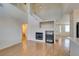 Open living space with fireplace, wine cooler, and stairs at 832 Clear Diamond Ave, Las Vegas, NV 89123