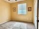 Empty bedroom features neutral carpet, window with blinds, and standard trim at 8477 Orly Ave, Las Vegas, NV 89143