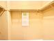 Functional closet with a rod for hanging clothes and upper storage shelves at 8477 Orly Ave, Las Vegas, NV 89143