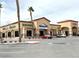Well-maintained commercial building featuring various businesses and ample parking at 8477 Orly Ave, Las Vegas, NV 89143