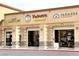 Retail space featuring multiple businesses with prominent signage and pedestrian-friendly access at 8477 Orly Ave, Las Vegas, NV 89143