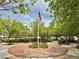 Community park featuring a flagpole surrounded by trees and greenery, ideal for residents at 8477 Orly Ave, Las Vegas, NV 89143