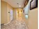 Spacious foyer featuring tiled floors, a window with blinds, and an accent wall decor at 8477 Orly Ave, Las Vegas, NV 89143