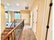 Upstairs hallway with neutral carpet and walls, features white doors and dark hardware at 8477 Orly Ave, Las Vegas, NV 89143